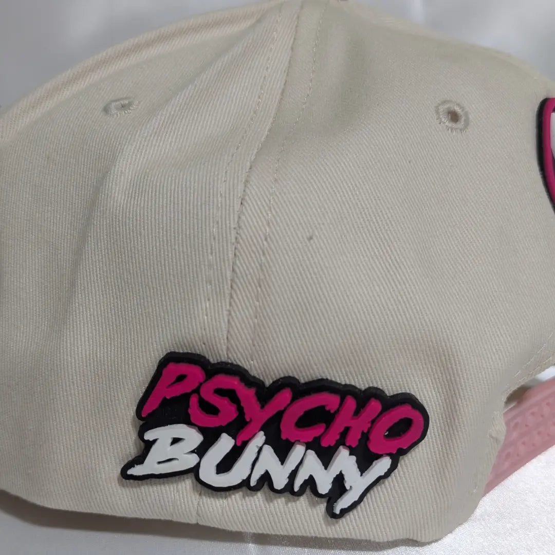 Gorra visera plana diseño Psycho Bunny bicolor
